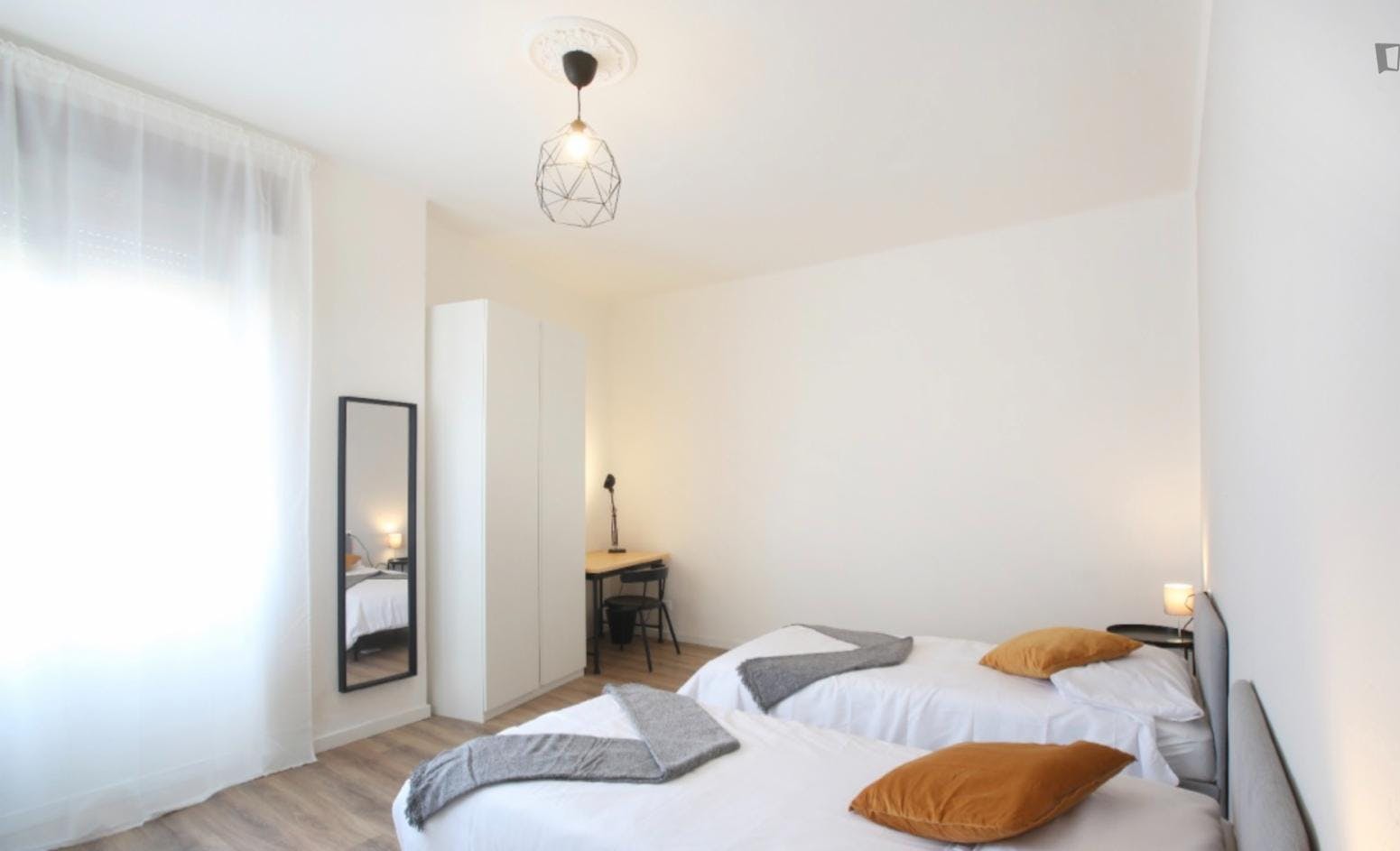Bed in a twin bedroom near Parco Giardino Ducale Estense