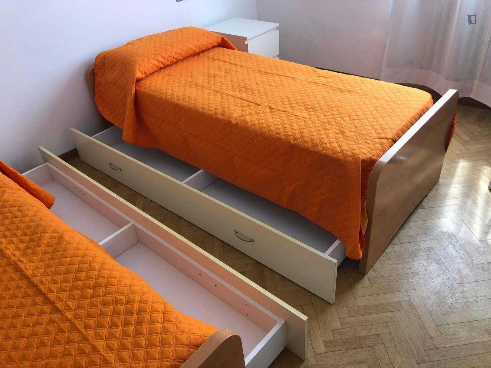 Bed in a twin bedroom near Polo Chimico Biomedico