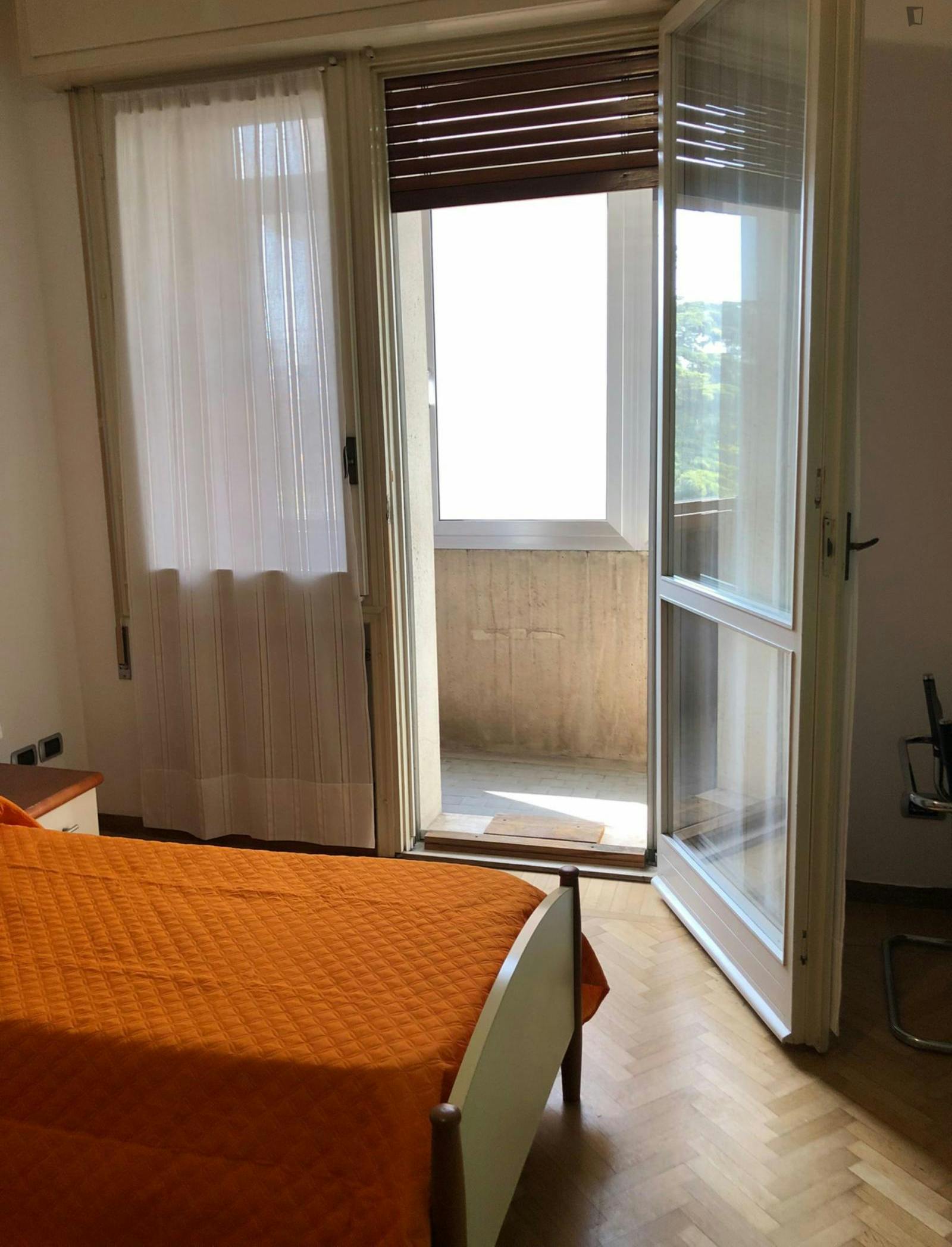 Bed in a twin bedroom with balcony next to Sottomura Est e degli Angeli