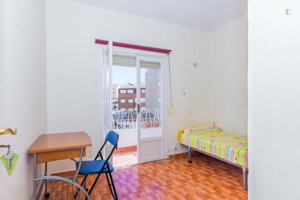 Humble single bedroom with a sunny balcony, in Campoamor