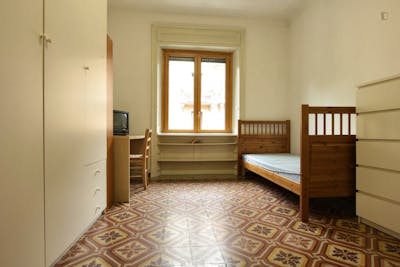 Bed in a twin bedroom in Città Studi