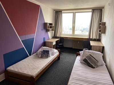 Bed in a twin bedroom, in a residence near Modřanská rokle
