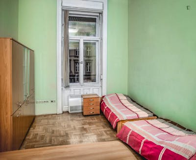 Bed in a twin bedroom, part of a residence next to Budapest-Nyugati transport station