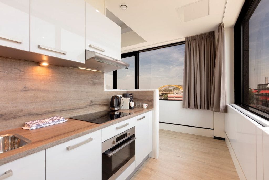 Panoramic Suite with kitchen with glass on 3 sides and a beautiful view over the city of Utrecht