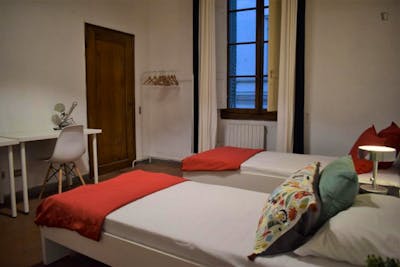 Bed in a comfy twin bedroom, in Santa Maria Novella