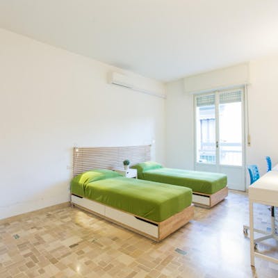 Bed in a nice twin bedroom, near the Certosa train station